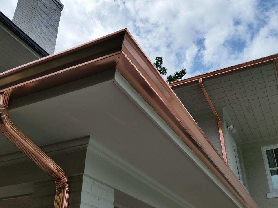 Contemporary gutter with downspout